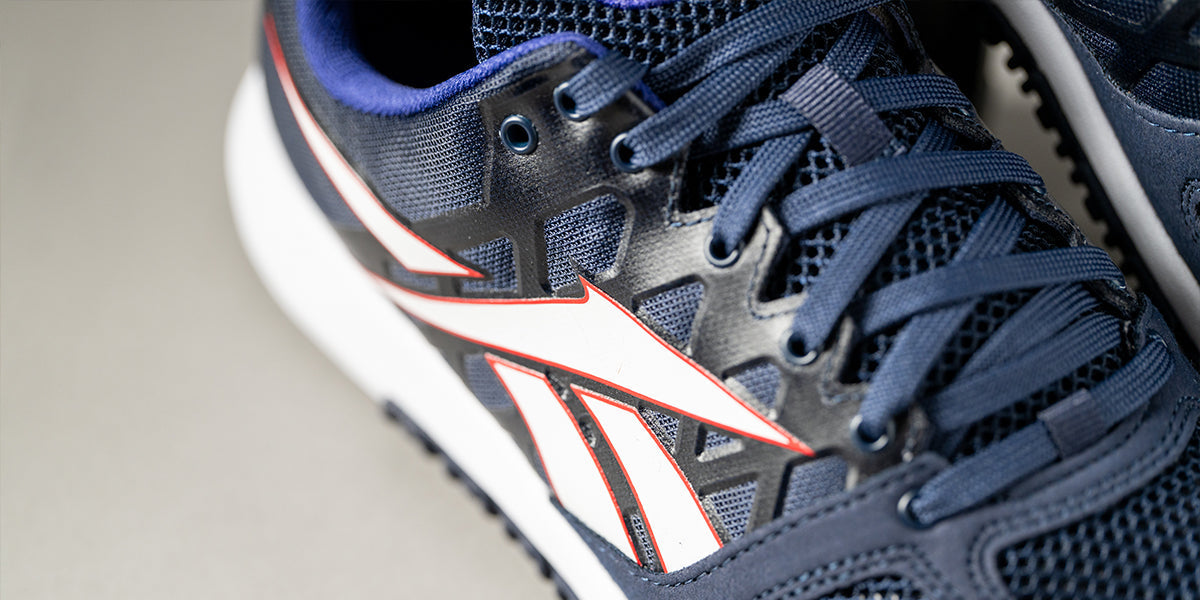 Downward angle of a blue/white/red Reebok Nano 2.0