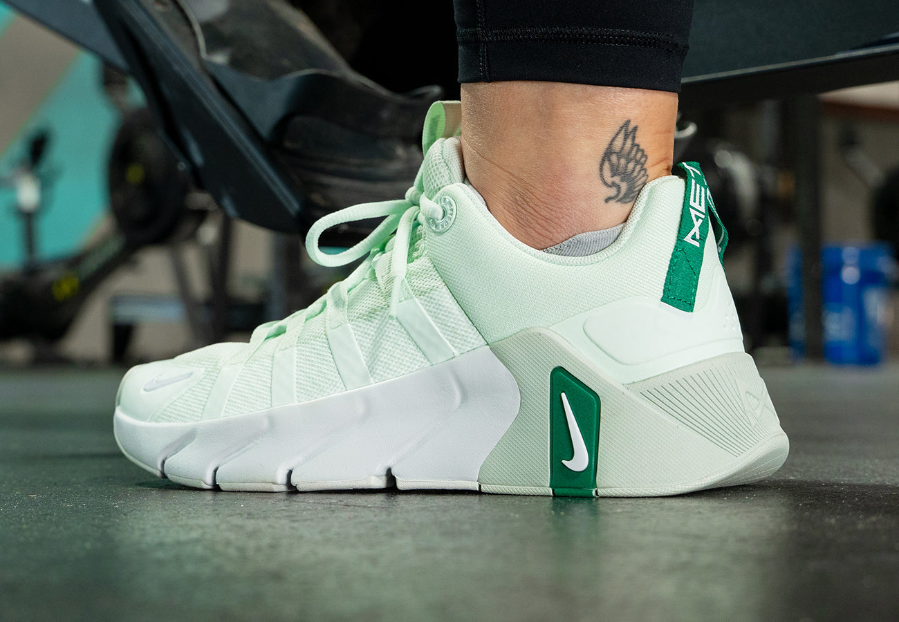 Female athlete wearing Nike Free Metcon 7 (Barely Green)